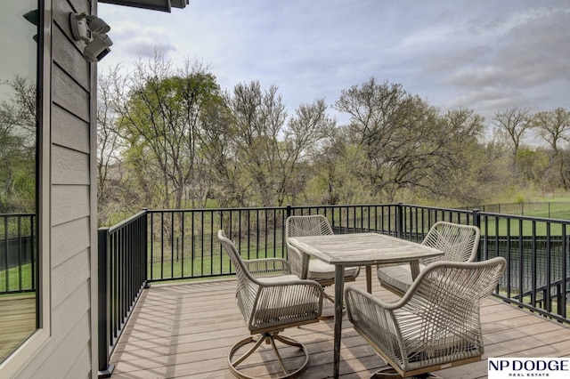 deck with outdoor dining space