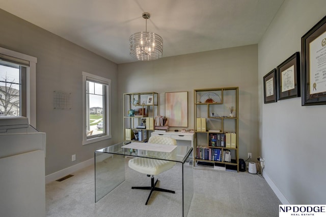 carpeted office space with baseboards, a notable chandelier, and visible vents