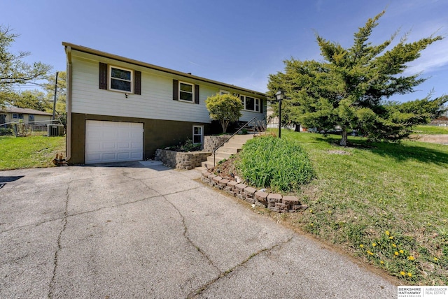 view of front of house with driveway, central AC unit, stairway, a front lawn, and an attached garage