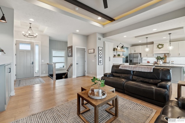 17026 Emma St, Bennington, NE 68007 - living area featuring an inviting chandelier, visible vents, baseboards, light wood-style floors, and recessed lighting
