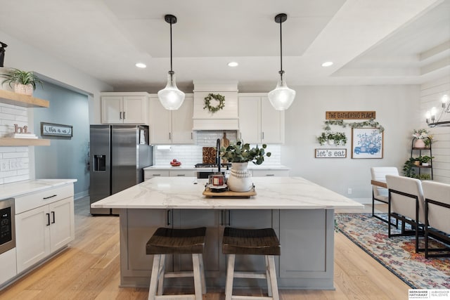 17026 Emma St, Bennington, NE 68007 - kitchen featuring open shelves, stainless steel refrigerator with ice dispenser, and white cabinetry