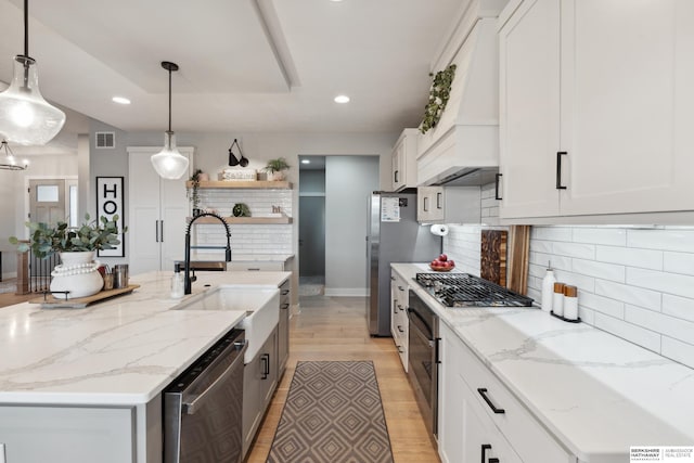 17026 Emma St, Bennington, NE 68007 - kitchen featuring visible vents, open shelves, white cabinetry, a sink, and appliances with stainless steel finishes