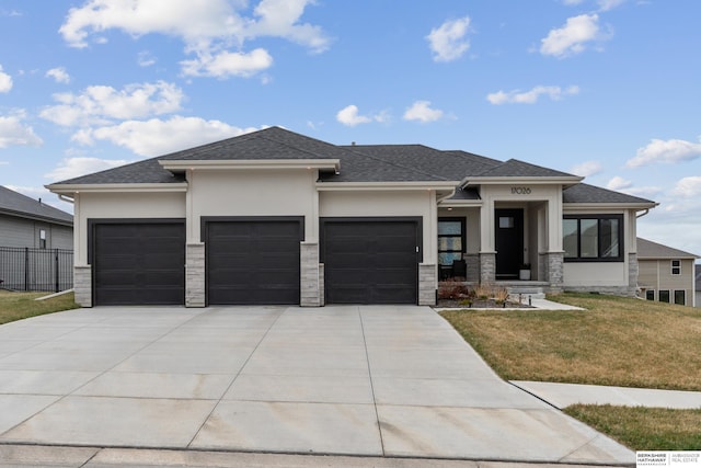 17026 Emma St, Bennington, NE 68007 - prairie-style home featuring an attached garage, a front lawn, stone siding, and stucco siding