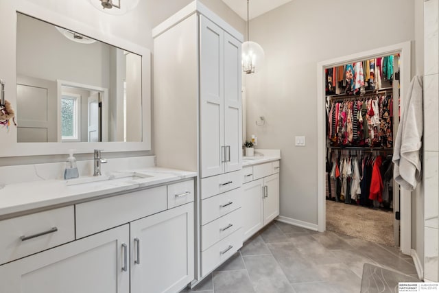 17026 Emma St, Bennington, NE 68007 - full bath featuring a sink, baseboards, and two vanities