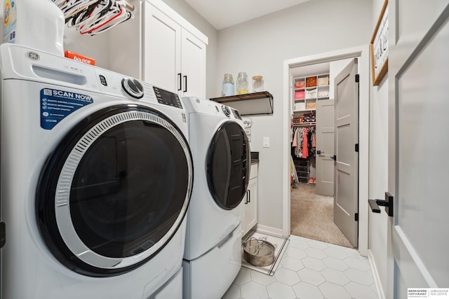 17026 Emma St, Bennington, NE 68007 - laundry area with cabinet space, light tile patterned floors, light colored carpet, and washer and clothes dryer