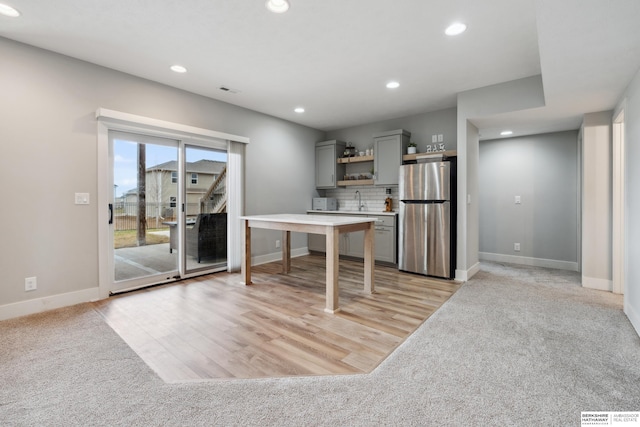 17026 Emma St, Bennington, NE 68007 - kitchen featuring open shelves, gray cabinets, freestanding refrigerator, and recessed lighting