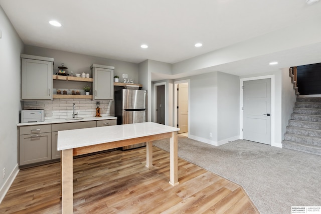 17026 Emma St, Bennington, NE 68007 - kitchen featuring freestanding refrigerator, open shelves, gray cabinetry, and a sink