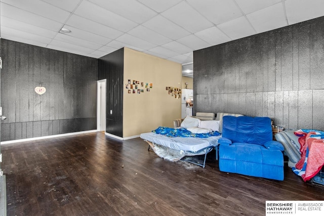 109 W Elk St, Hooper, NE 68031 - interior space featuring wooden walls, a drop ceiling, and wood finished floors