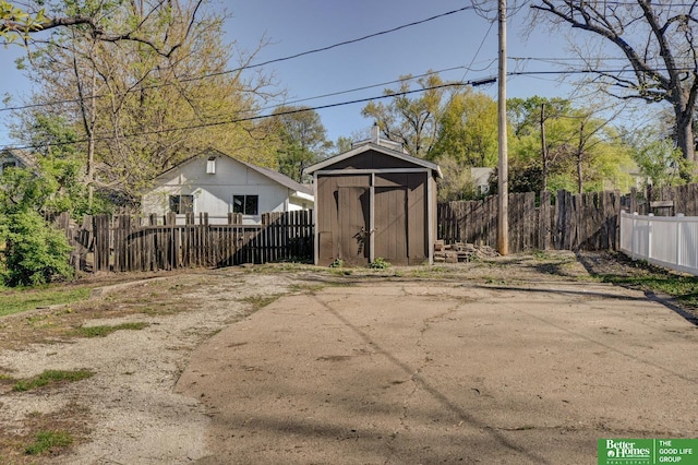 view of shed featuring fence private yard