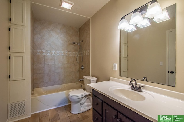 full bath featuring toilet, shower / bathing tub combination, wood finished floors, and vanity