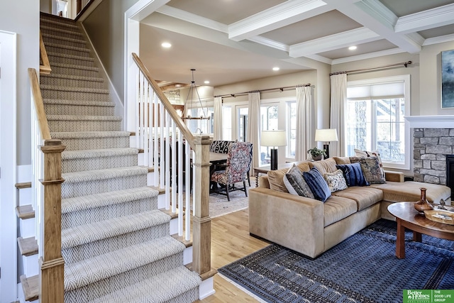 living room with light wood-style floors, beamed ceiling, stairway, and recessed lighting