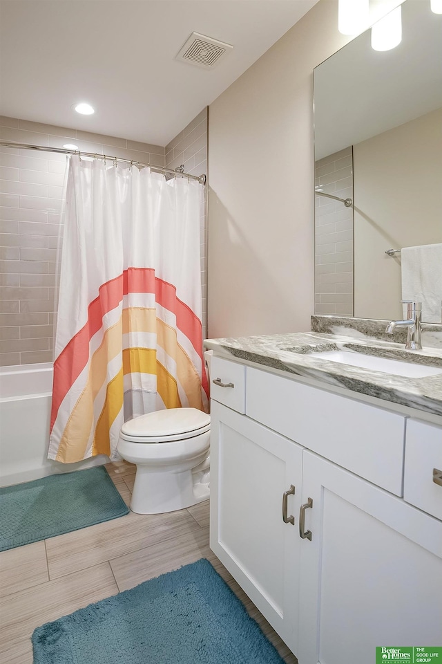 full bath featuring vanity, toilet, shower / bath combination with curtain, recessed lighting, and visible vents