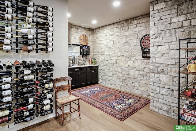wine room featuring visible vents and wood finished floors