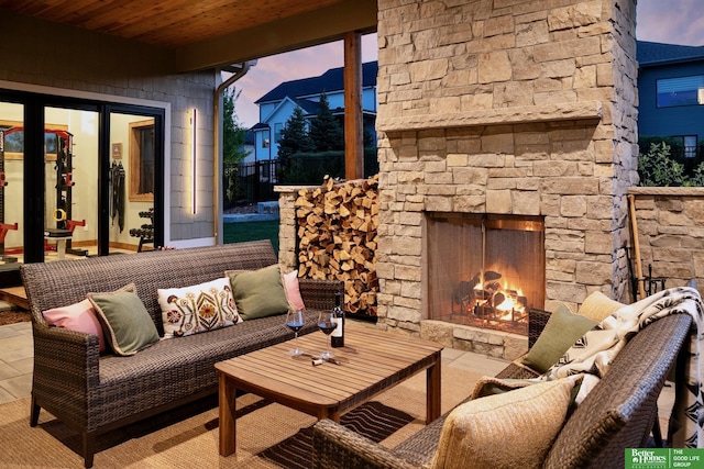 exterior space featuring an outdoor living space with a fireplace