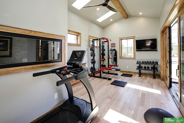 exercise area with ceiling fan, light wood-style floors, recessed lighting, baseboards, and a skylight