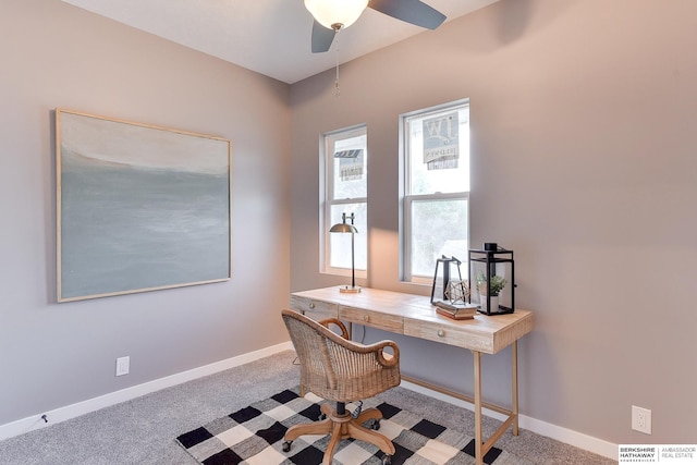office area featuring carpet flooring, baseboards, visible vents, and ceiling fan