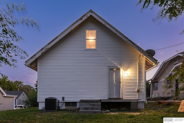 back of house with entry steps and central AC unit