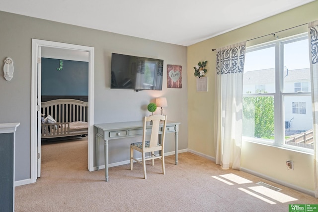 interior space with carpet flooring, baseboards, and visible vents