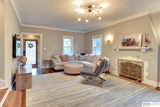 5117 Western Ave, Omaha, NE 68132 - living area featuring a chandelier, wood finished floors, baseboards, and ornamental molding