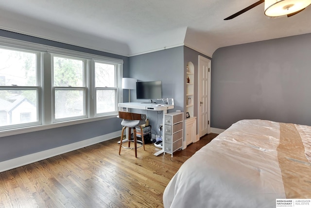 5117 Western Ave, Omaha, NE 68132 - bedroom with baseboards, wood finished floors, a desk, and vaulted ceiling