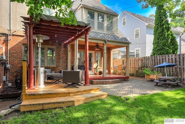 5117 Western Ave, Omaha, NE 68132 - rear view of property featuring fence, a ceiling fan, a patio, and brick siding
