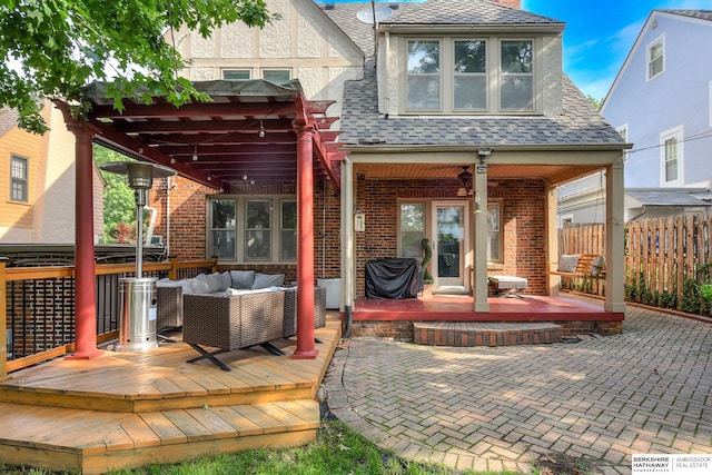 5117 Western Ave, Omaha, NE 68132 - back of house with a wooden deck, an outdoor living space, fence, brick siding, and a pergola
