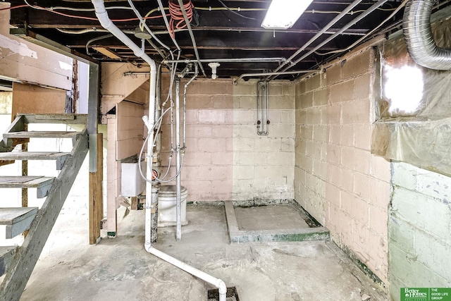 unfinished below grade area featuring stairs
