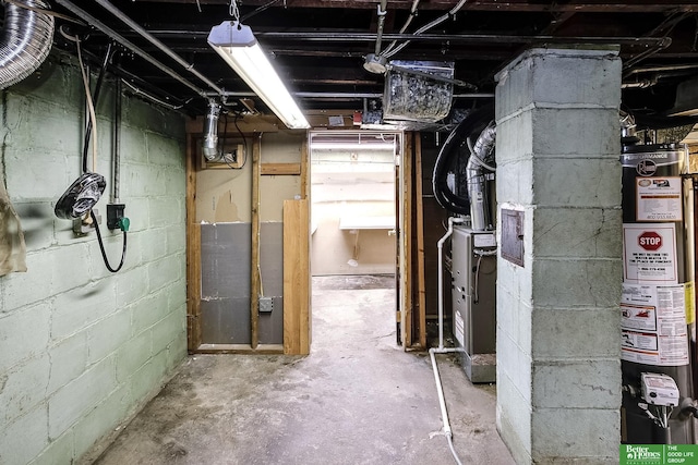 unfinished basement featuring gas water heater