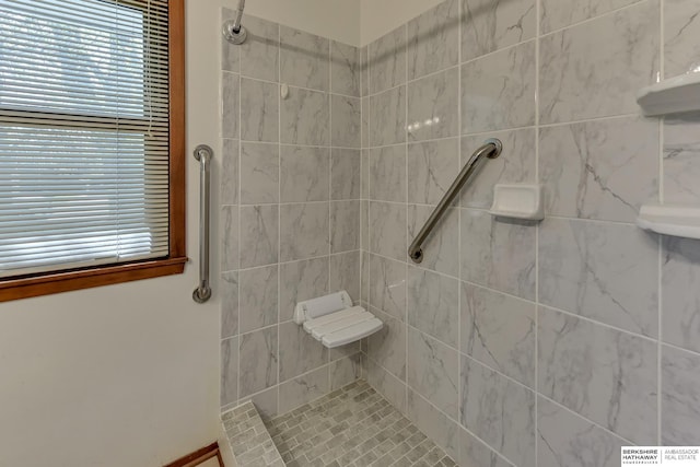full bath featuring tiled shower