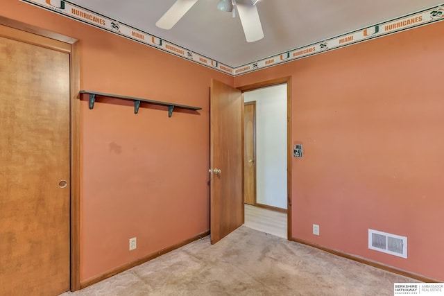 unfurnished room featuring baseboards, ceiling fan, carpet, and visible vents