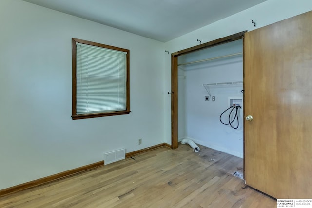laundry area featuring visible vents, laundry area, hookup for a washing machine, light wood-type flooring, and hookup for an electric dryer