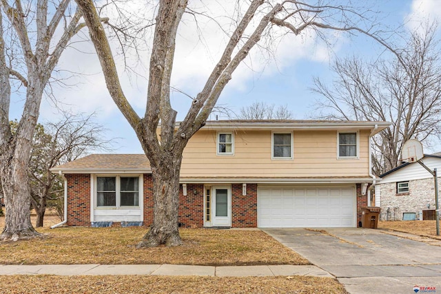 traditional-style home with an attached garage, concrete driveway, and brick siding