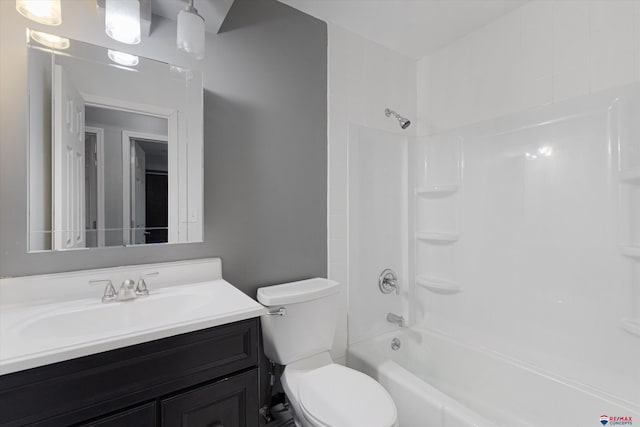 bathroom with vanity, shower / bathing tub combination, and toilet