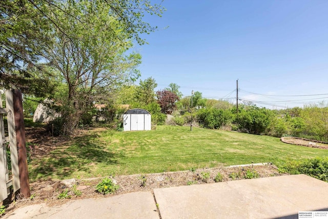 view of yard featuring an outbuilding and a storage shed