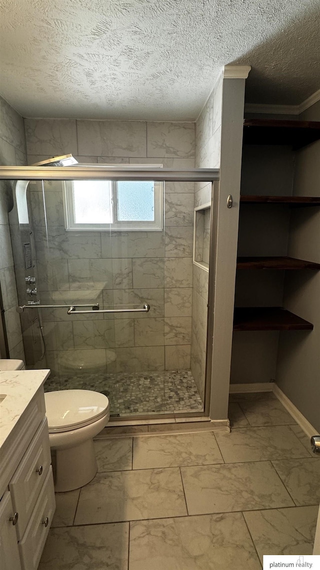 bathroom featuring vanity, a stall shower, toilet, and marble finish floor