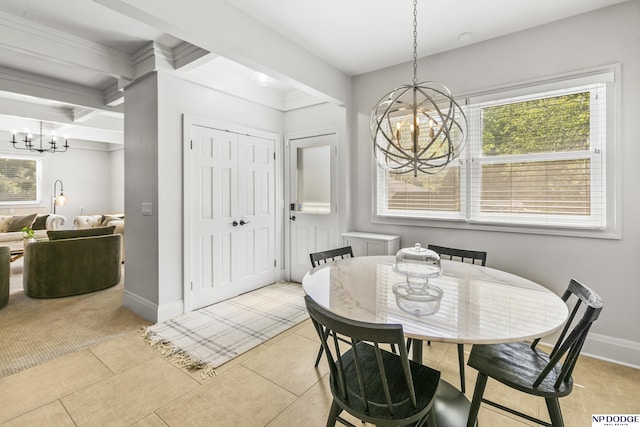 dining area with an inviting chandelier, baseboards, light tile patterned floors, and a wealth of natural light