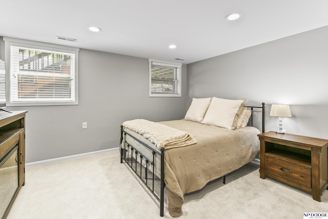 bedroom with recessed lighting, baseboards, visible vents, and light carpet