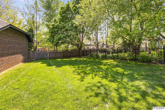 view of yard with a fenced backyard