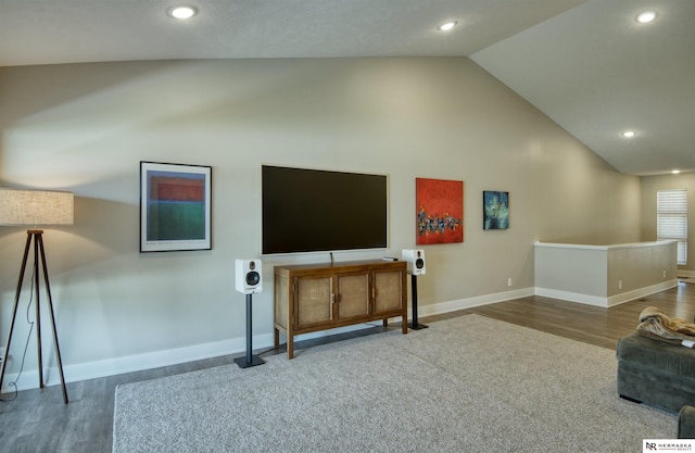 living area featuring recessed lighting, high vaulted ceiling, baseboards, and wood finished floors