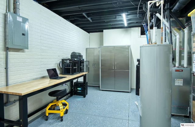 basement with gas water heater, electric panel, and brick wall
