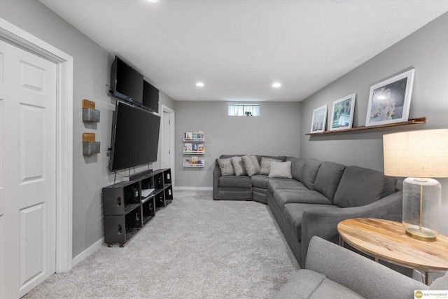 carpeted living room featuring baseboards and recessed lighting