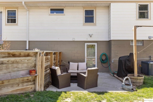 back of property featuring a patio and cooling unit