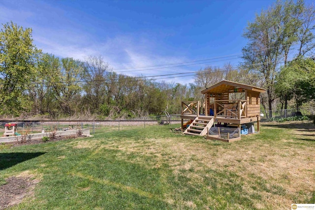 view of yard with a deck and a fenced backyard