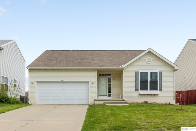 ranch-style house featuring a garage, fence, driveway, and a front lawn