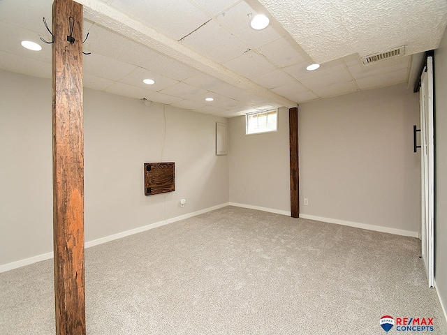 basement with recessed lighting, baseboards, visible vents, and carpet