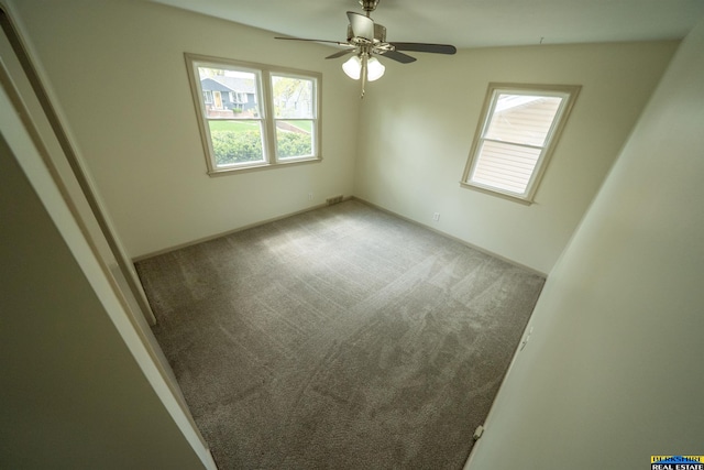 interior space featuring ceiling fan, carpet, and visible vents