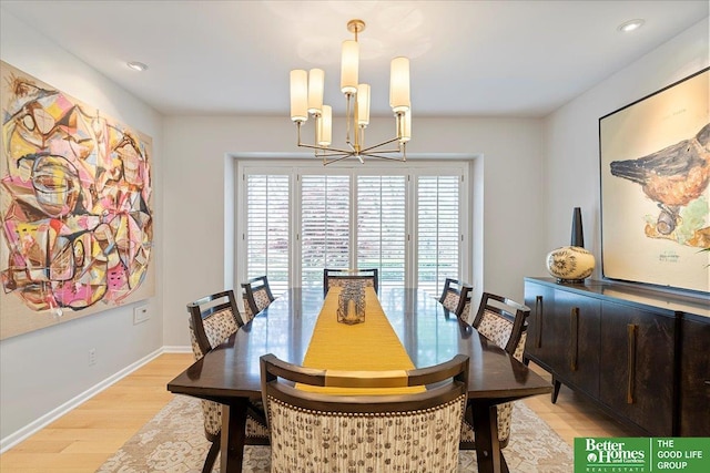 dining space with baseboards, recessed lighting, light wood-style flooring, and a chandelier