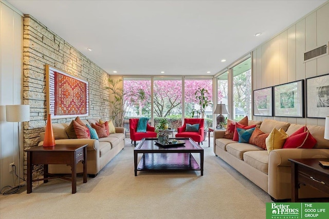 carpeted living area featuring visible vents, recessed lighting, and floor to ceiling windows