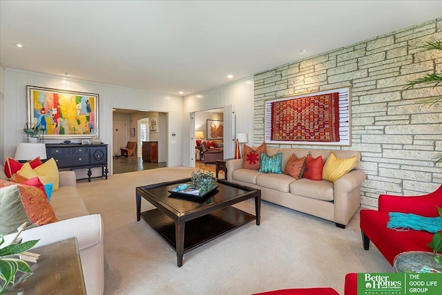 carpeted living room with crown molding
