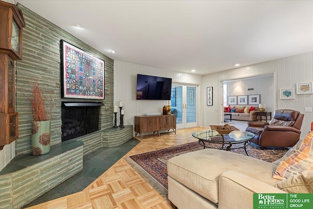 living area featuring recessed lighting and a large fireplace